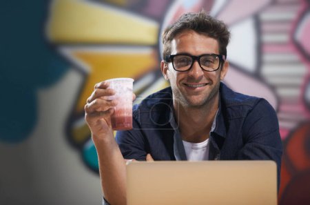Photo for Portrait, drink or man on laptop for research, information and email for blog, article and copywriting in a startup. Journalist, freelancer or creative writer on break in modern office with smoothie. - Royalty Free Image