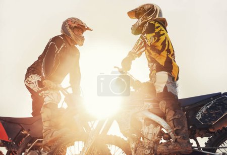 Photo for Sport, racer or people on motorcycle outdoor on dirt road with relax after driving, challenge or competition. Motocross, lens flare or dirtbike driver or friends on offroad course or path for sunset. - Royalty Free Image