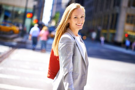 Photo for Woman, portrait and smile with city, travel and commute for work or career. Designer, job and new york street with urban, summer and happiness with confident and creative business walk in downtown. - Royalty Free Image