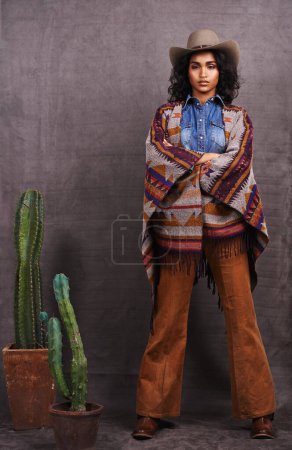 Photo for Cactus, fashion or cowgirl in style, portrait, wild west culture or cool clothes in studio on grey background. Confident person, western woman or stylish model with pride, boho outfit or plants. - Royalty Free Image