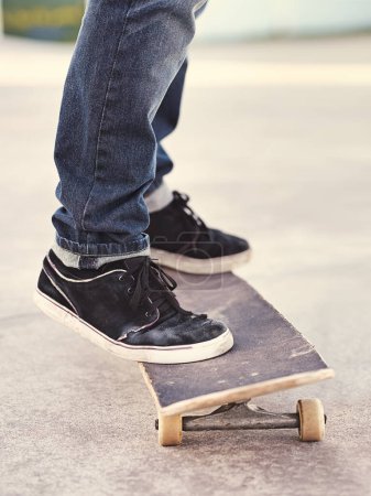 Photo for Closeup, shoes and skateboard with energy, person and fitness with performance and hobby with skill. Skater, outdoor or summer with sneakers, cardio or sunshine with talent or balance with recreation. - Royalty Free Image