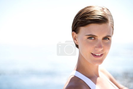 Photo for Fitness, portrait and happy woman on beach for morning workout, cardio exercise or outdoor training. Confidence, active and face of female person for healthy body, wellness and smile at ocean. - Royalty Free Image