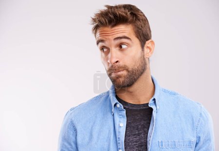Photo for Thinking, confused and man with ideas, unsure or uncertain on white studio background with solution or emoji. Person, model or guy with thought or question with why and emotion with reaction or doubt. - Royalty Free Image