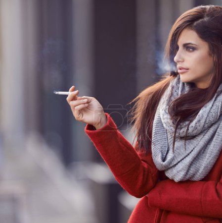 Photo for Woman, fashion and cigarette in city to think for stress relief or break as habit or daily routine for pressure escape in New York. Female person, nicotine outdoor and smoke tobacco, contemplating. - Royalty Free Image