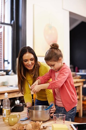Photo for Teaching, baking and mother with girl, kid and ingredients with skills and bonding together with recipe. Family, mama and daughter in a kitchen, prepare food and hobby with meal, learning and happy. - Royalty Free Image