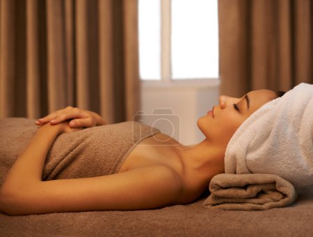 Photo for Body, relax and woman at massage table in spa for skincare, wellness or sleeping at bed with eyes closed at luxury resort. Cosmetics, resting and person at salon for peace, calm or beauty therapy. - Royalty Free Image