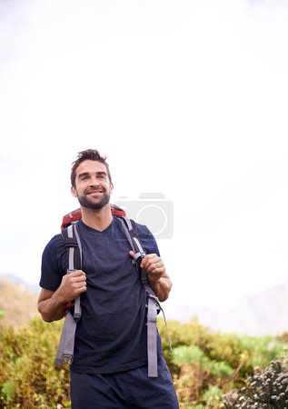 Photo for Man, hike and happy for adventure with backpacker for fitness, workout and hobby on mountain top in countryside. Explore, smile and outdoor activity in nature for healthy mind in woods on holiday. - Royalty Free Image