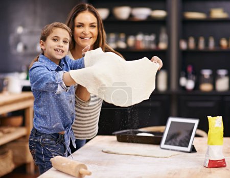 Photo for Portrait, mother or child baking pizza in a kitchen teaching recipe for help, support or learning in home. Kid, tablet or girl cooking with parent, family and mom for dinner, supper or lunch together. - Royalty Free Image