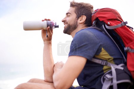 Photo for Man, hiking and break for water, health and wellness with bottle and mountain. Athlete, exercise and adventure with summer, sunshine and backpack journey on cape town trail with travel and vacation. - Royalty Free Image