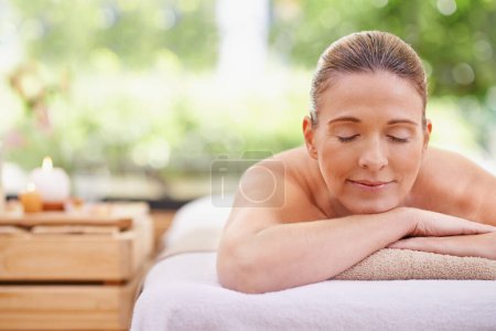 Photo for Happy woman, sleeping and relax with towel for spa, zen or massage table at hotel or outdoor resort. Face of female person with smile or enjoying peaceful body treatment at accommodation for wellness. - Royalty Free Image