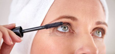 Photo for Makeup, mascara and face of woman with brush in studio for beauty, cosmetics or application. Eyelash, grey background or closeup of female model with eyelashes tool for volume, glamour or aesthetic. - Royalty Free Image