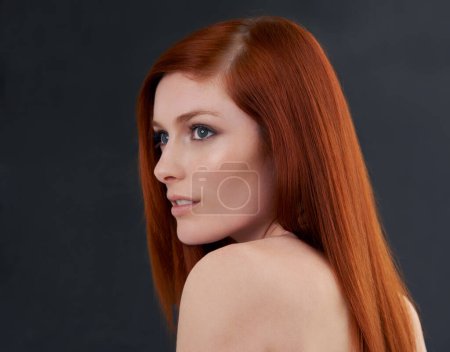 Photo for Hair care, red and woman with shine, wellness and treatment with beauty on a dark studio background. Luxury, person and model with shampoo and grooming routine with growth or cosmetics with beauty. - Royalty Free Image