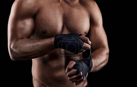 Photo for Boxing, person or hand wrap in studio with getting ready to fight, exercise or training on mockup space. Athlete, boxer or martial arts workout for competition, closeup or topless on black background. - Royalty Free Image