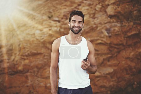 Photo for Earphones, exercise and portrait of man with smile for fitness, training and podcast for cardio. Male person, earphones and face with happiness for audio, streaming or podcast for morning workout. - Royalty Free Image