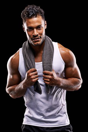 Photo for Fitness, portrait and strong man in studio with muscle, confidence and workout for health, wellness and power. Smile, towel and athlete on black background for exercise, results and sports challenge. - Royalty Free Image