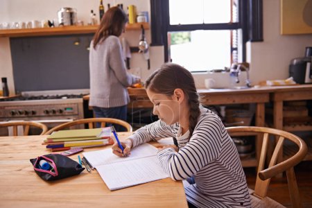 Photo for Girl, kid and homework with studying in kitchen with writing, development or notes for education in house. Child, notebook and thinking with learning, language and ideas for assessment in family home. - Royalty Free Image