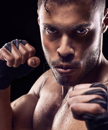 Photo for Fitness, portrait and man boxer in studio for power, resilience and training on black background. Fighter, hands by face of sweaty kickboxing male at gym for wellness, exercise or energy workout. - Royalty Free Image
