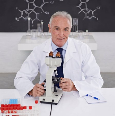 Photo for Scientist, man and portrait with microscope in lab for vaccine study, development or dna test. Mature doctor, smile and biotechnology for bacteria sample, medical research or growth in chemistry. - Royalty Free Image