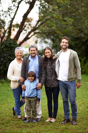 Photo for Family, smile and portrait in garden or backyard for relationship, grandparents and child with mom and dad for joy. Group, senior people and kid for bonding, love and happiness together in park. - Royalty Free Image