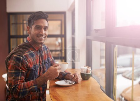 Photo for Happy man, portrait and cafe with coffee by window for morning, breakfast or start of the day. Male person with smile, drink or beverage in relax for caffeine, mug or cup of tea at indoor restaurant. - Royalty Free Image