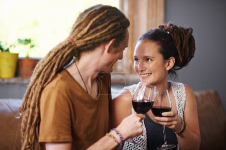 Photo for Couple, wine and cheers for love, romance and joy for romantic, dating and relationship together for unwind. Boyfriend, girlfriend and rasta with glass and smile and relax with drink in lounge. - Royalty Free Image
