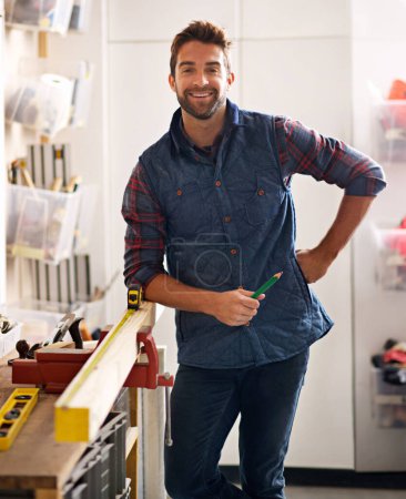 Photo for Portrait, wood and carpenter man with diy tools for home development, woodwork and building renovation. Smiling, male employee and contractor for maintenance, equipment and repair work in garage. - Royalty Free Image