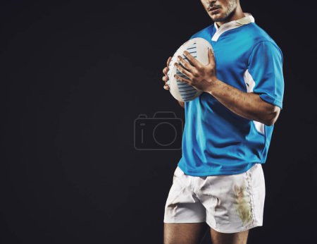 Photo for Black background, man and ball for rugby sport, closeup and mockup space, sportswear and professional for workout. Male person or player, fitness and athlete for football game or match and strong. - Royalty Free Image