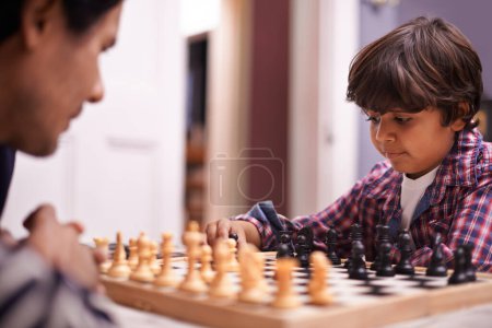 Photo for Child, father and chess strategy or planning checkmate move with knight, king or queen. Son, parent and thinking for competition learning or decision thoughts for playing, contest or problem solving. - Royalty Free Image