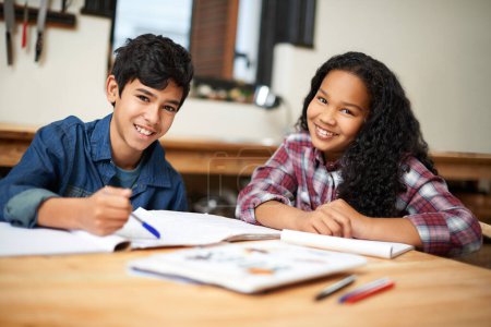 Photo for School students, friends and portrait with homework books in class together for assignment, teamwork or education. Teenagers, boy and girl at desk for creative writing, knowledge or brainstorming. - Royalty Free Image