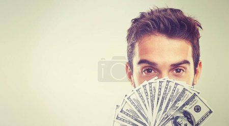Photo for Eyes, money and savings or profit in studio on white background for business investment and funding. Portrait, closeup and paper notes or cash prize as reward for startup company and growth - Royalty Free Image