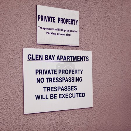 Trespassing, warning and sign on apartment of property for caution, notification and information. Public signage, symbol and private building with board, poster and mistake for attention or safety.
