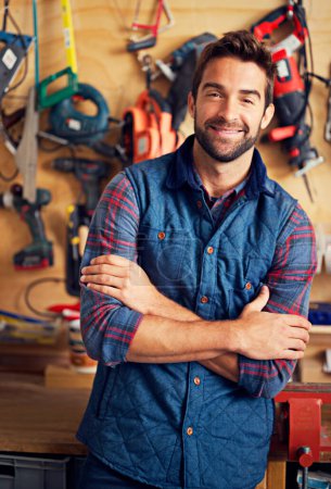 Photo for Man, tools and portrait in workshop or garage for diy, repair and maintenance for job, skill or tradesman. Artisan, handyman or carpenter with smile and confident with equipment for repairs indoor. - Royalty Free Image