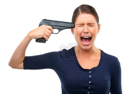 Depression, gun or angry woman shouting in studio for stress, warning or mental health crisis on white background. Temple, weapon or lady model scream with anxiety, overthinking or self harm disaster.