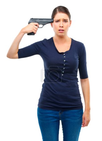 Depression, gun or portrait of sad woman in studio for stress, warning or mental health crisis on white background. Temple, weapon or lady model frown with anxiety, overthinking or self harm disaster.