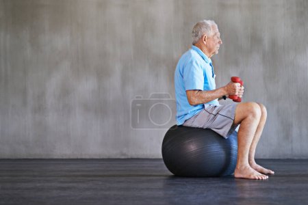 Photo for Senior man, dumbbells and workout with ball for fitness, wellness and physiotherapy at gym on mockup space. Elderly person, weightlifting and training for physical therapy, muscle or body health. - Royalty Free Image