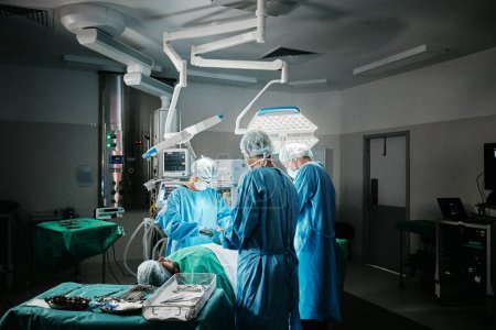 Photo for Surgery, theatre or surgeons with teamwork for emergency, accident or healthcare in hospital clinic. Light, medical operation or doctors in surgical collaboration in operating room to support or help. - Royalty Free Image