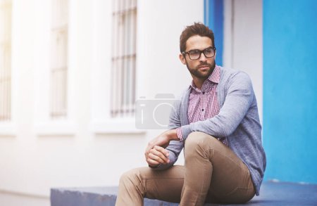 Photo for Man, fashion and confident in city with glasses, black frame for style with chic outfit and pride. Urban, unique and trendy designer clothes, spectacles for accessory and apparel with model outdoor. - Royalty Free Image