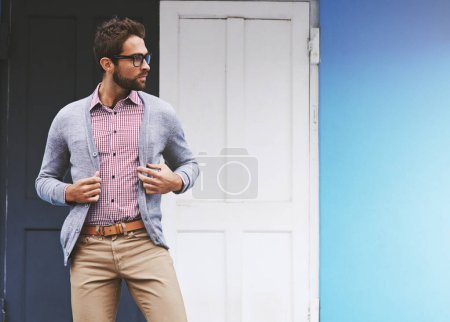 Photo for Man, fashion and posing in city with glasses, confident with black frame for style and chic outfit. Urban, unique and trendy designer clothes, spectacles for accessory and apparel with model outdoor. - Royalty Free Image