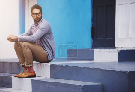 Photo for Man, building and sitting on stairs for fashion, clothes and trendy with glasses outdoor in Cape Town, South Africa. Male person, gen z guy and vision for unique outfit, edgy and urban style. - Royalty Free Image