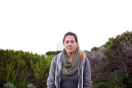 Photo for Portrait, outdoor and hiking with woman, wellness and relaxing with stress relief and weekend break with hobby. Face, person and hiker with flowers and healthy with nature and landscape with fitness. - Royalty Free Image