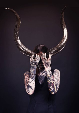 Photo for Horns, demon and woman with tattoo in studio for dark magic, horror or artistic aesthetic with mask. Creative nightmare, halloween culture or unique female person with scary bones on black background. - Royalty Free Image