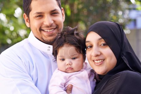 Photo for Muslim, family and portrait of parents with baby in park for bonding, Ramadan and outdoors together. Islam, happy and mother, father and newborn infant for love, childcare or support in garden. - Royalty Free Image