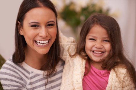 Photo for Portrait, mother and daughter with smile for love in home with joy, care and happiness. Apartment, mom and girl in lounge to relax on sofa or couch with hug for bonding in living room of house. - Royalty Free Image