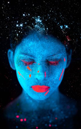 Photo for Face, neon and psychedelic paint for color, art and glitter with unique surreal glow. Person, science fiction and creative with dream, rave and abstract uv illusion for mystical fluorescent trance. - Royalty Free Image