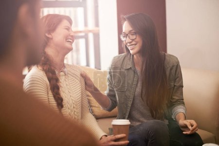 Photo for Coffee shop, laugh and women with drink in conversation, talking and chatting for social visit. Friends, discussion and people with caffeine, cappuccino and beverage in restaurant, cafe and store. - Royalty Free Image