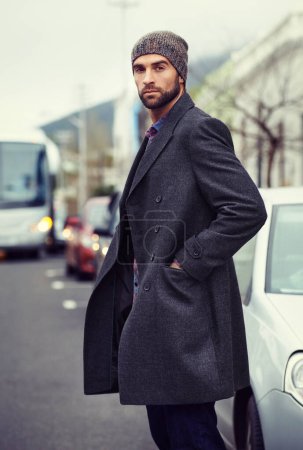 Photo for Fashion, portrait or man in street with coat for edgy clothes, outdoor travel or elegant style for winter outfit. City, cool model or stylish person in urban town in beanie or trendy jacket in Italy. - Royalty Free Image