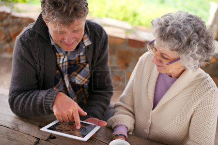 Photo for Senior couple, tablet or app to search, internet or contact on social media, blog or relax on patio. Man, woman or touch screen to browse, learn or download of meme, news or ebook on web app for fun. - Royalty Free Image