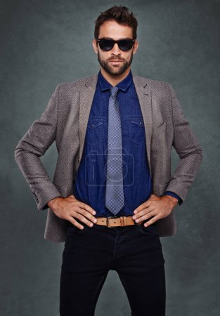Photo for Suit, fashion and portrait of man with sunglasses and confidence in studio, background and mockup. Cool, style and model with pride for professional outfit or person with luxury designer clothes. - Royalty Free Image