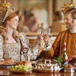 Royal, king and queen in renaissance with luxury, wine and happiness with toast together for wedding night. Noble, man and woman with smile for wealth in marriage and girl with husband in palace.
