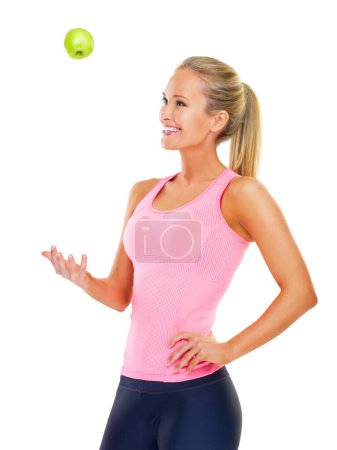 Woman, apple and diet nutrition for wellness in studio or health training, lose weight or white background. Female person, happy and fitness workout with fruit snack or organic, fibre or mockup space.